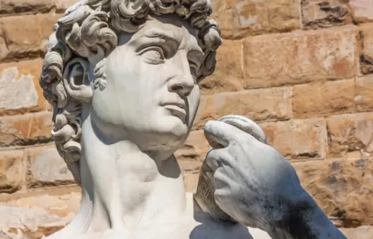 Active adult travelers walking historic Venetian street